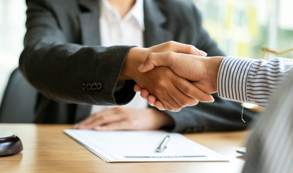 Commercial lawyer reviewing business sale contract, Melbourne