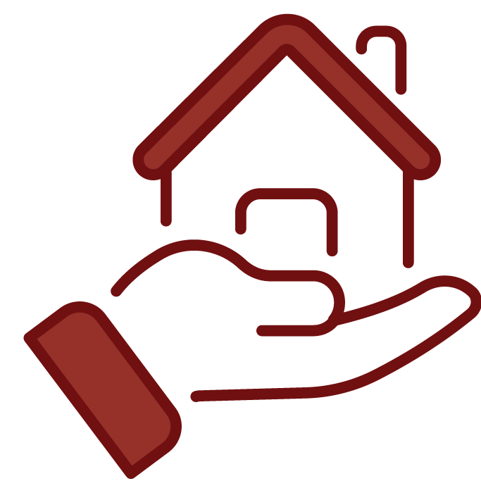 A hand holding a small home